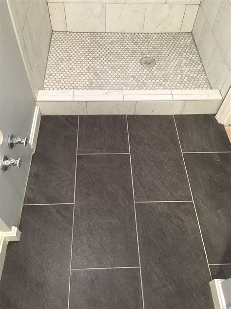 A smooth flat finish with a natural pebble look, perfect for accents, bathrooms and backsplashes. . Lowes shower floor tile